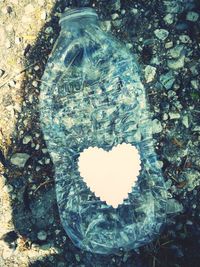 Digital composite image of glass with sea in background