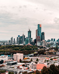 High angle view of buildings in city against sky