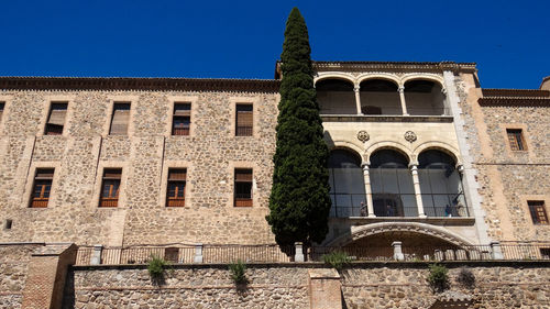 Low angle view of building against blue sky