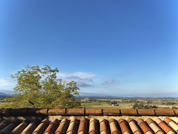 Scenic view of landscape against blue sky