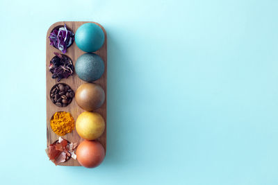 High angle view of multi colored candies against blue background