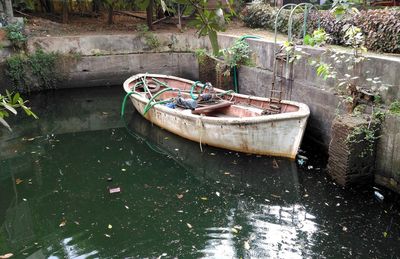 High angle view of abandoned boat moored on lake