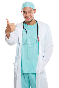 Portrait of young man standing against white background