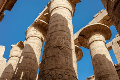 Different columns with hieroglyphs in karnak temple. karnak temple is the largest complex in egypt.