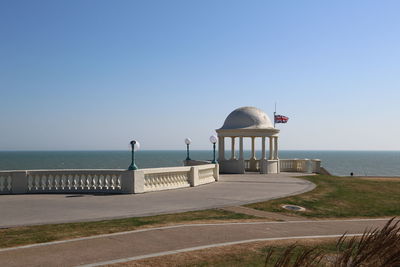 Lifeguard hut on beach against clear sky