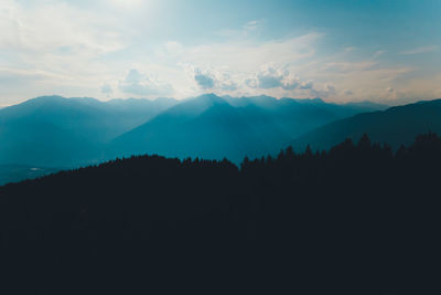 Scenic view of silhouette mountains against sky