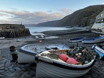 Two small boats waiting for tide to come in. old historic town in devon 