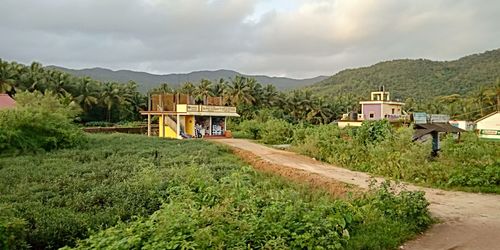 Built structure on landscape against sky