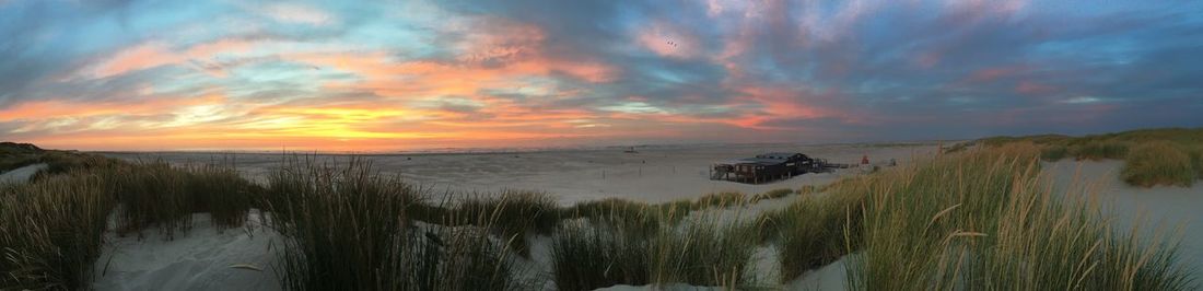 Panoramic view of sea against sky during sunset