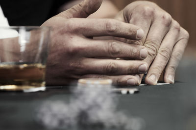 Close-up of hands on table