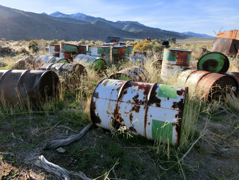 Abandoned barrels on field