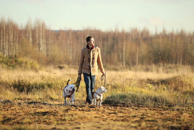 Man with dog on field