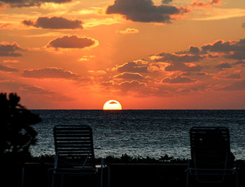 Scenic view of sea against orange sky