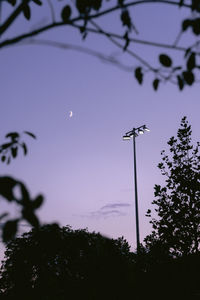 Low angle view of electricity pylon against sky