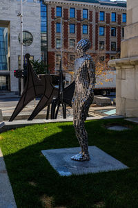 Man standing by building in city