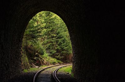 View of railroad track through tunnel