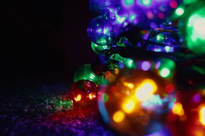 Close-up of illuminated christmas lights on table