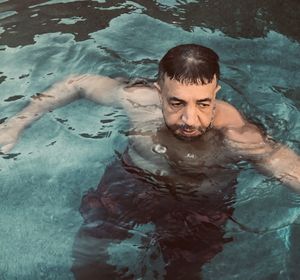 High angle view of man swimming in lake