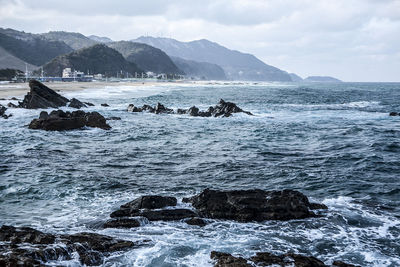 Scenic view of sea against cloudy sky