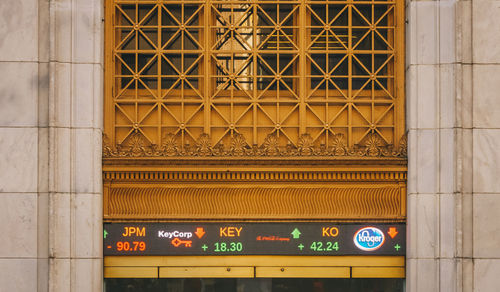 Low angle view of illuminated sign on building