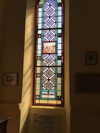 Low angle view of glass window in building