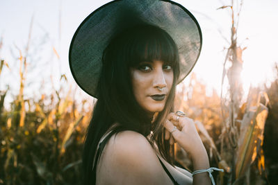 Portrait of young woman in hat