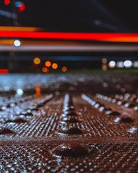 Close-up of wet metal at night