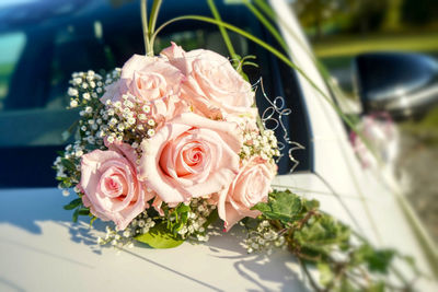 Close-up of rose bouquet bride car marriage