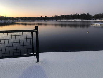 Scenic view of lake against sky during sunset