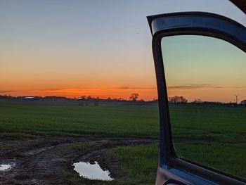 Scenic view of field against sky during sunset