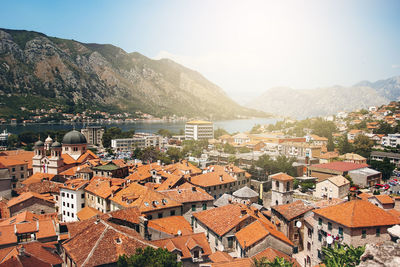 High angle view of townscape and river against sky