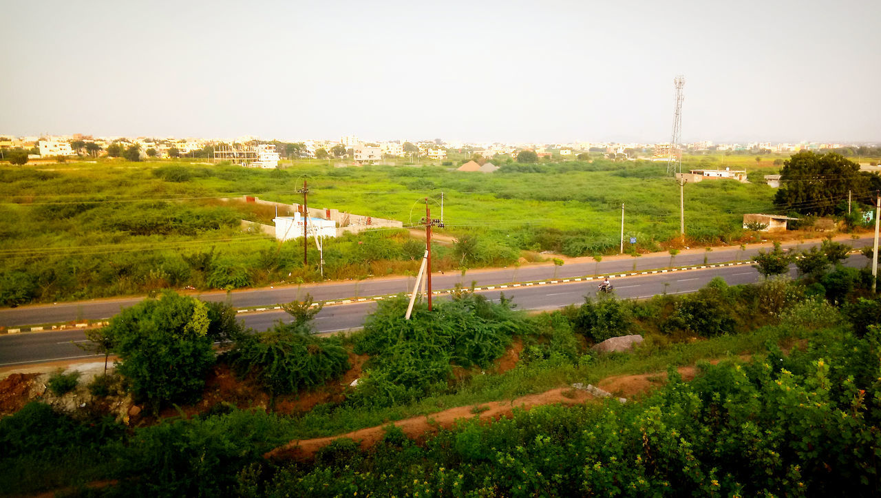 HIGH ANGLE VIEW OF FIELD AGAINST SKY