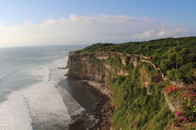 Scenic view of sea and cliff at uluwatu beach