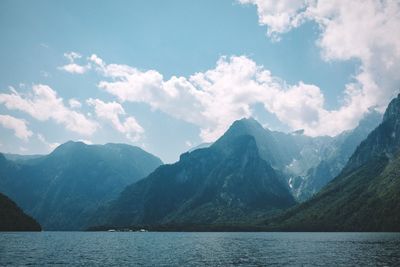 Scenic view of lake and mountains against sky