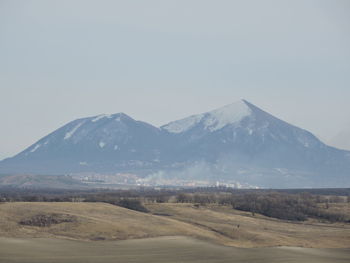 Scenic view of snowcapped mountains against clear sky. view on the pyatigorsk