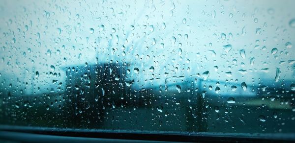 Full frame shot of raindrops on glass window