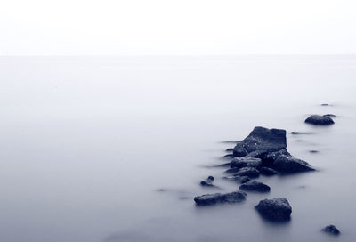 Scenic view of sea against sky during winter