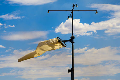 Low angle view of street light against sky