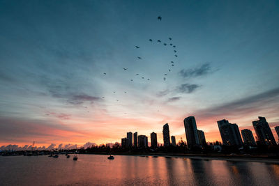 View of buildings against sky during sunset