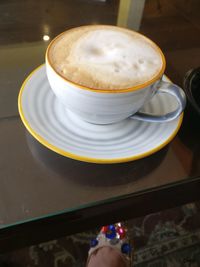 High angle view of coffee cup on table