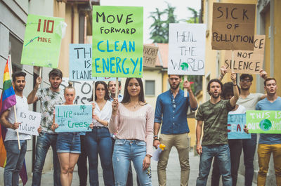 People protesting while standing on land