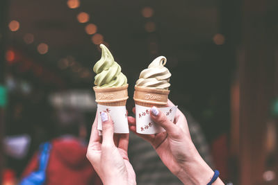 Cropped image of hand holding ice cream