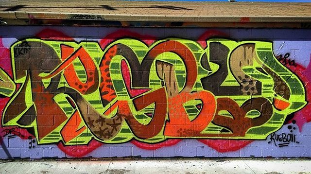 graffiti, art, art and craft, creativity, multi colored, built structure, architecture, wall - building feature, building exterior, street art, mural, human representation, yellow, text, wall, western script, colorful, animal representation, painting, vandalism