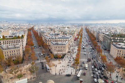 High angle view of cityscape against cloudy sky