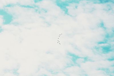 Low angle view of airplane flying in sky