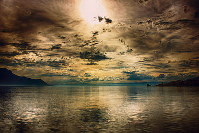 Scenic view of lake against sky during sunset