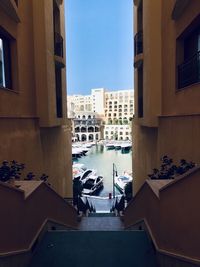 High angle view of sea by buildings in city