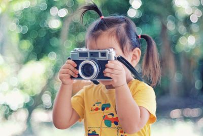 Portrait of girl photographing