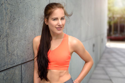 Portrait of young woman in sports clothing