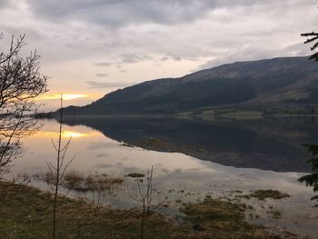 Scenic view of lake against sky during sunset